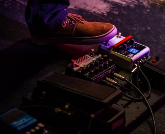 DA_promoters Image of a pedalboard beign used by a guitarist on stage