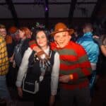 Photograph of a crowd of people dressed in Halloween Fancy dress for a Halloween club night