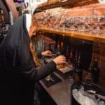 Photograph of a shot of alcohol being poured