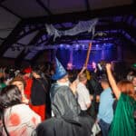 Photograph of a crowd of people dressed in Halloween Fancy dress for a Halloween club night