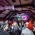 Photograph of a crowd of people dressed in Halloween Fancy dress for a Halloween club night