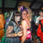 Photograph of a crowd of people dressed in Halloween Fancy dress for a Halloween club night