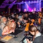 Photograph of a crowd of people dressed in Halloween Fancy dress for a Halloween club night