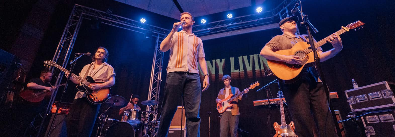 photograph of music venue docks academy with indie folk band skinny living performing on stage